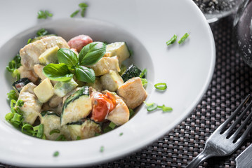 Cooked Chicken pieces with cooked vegetables