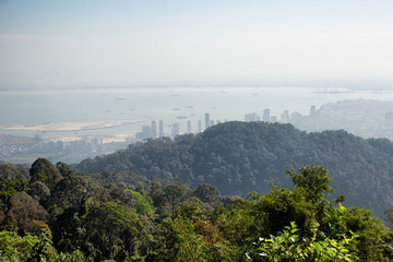 Fototapeta premium Lookng down through very heavy pollution haze to the city of George Town on Penang Island