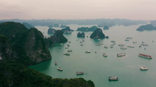 HALONG BAY, VIETNAM - APRIL, 2020: Aerial drone view of Halong Bay with cruise ships - famous tourist resort of Vietnam.