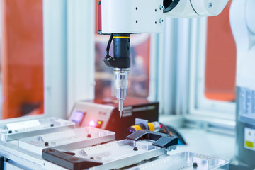 automatic robot drill machine tool at mobile industrial manufacture factory