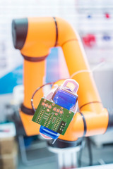 automatic robot for print circuit board (PCB)assembly machine during soldering or welding part at...