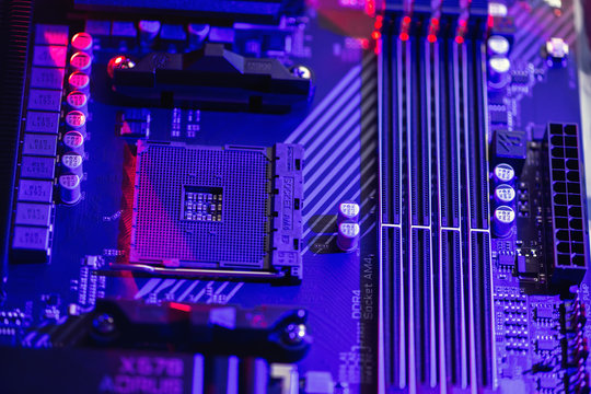.Socket am4. Close up of the AM4 socket for the motherboard with neon  blue and red lights. The view from the top. Technological background.
