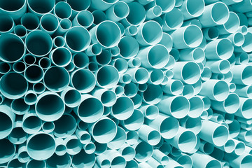 Blue plastic pipes used in construction site,PVC pipes stacked.
