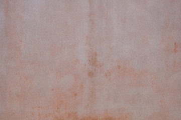 Wall plaster background texture. Pinkish color rough material