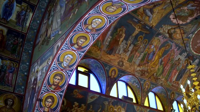 The inside of an orthodox Church in Europe, with its paintings of Saints