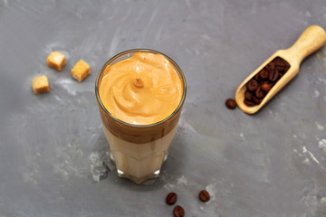 Dalgona coffee. Korean coffee in glasses with brown sugar, coffee on  white background. Drink cold milk. Top view. Copy space