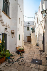 Fototapeta na wymiar Typical alley in beautiful small town of Cisternino, Apulia, South Italy