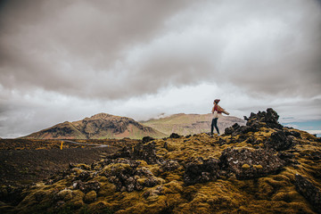 Plakat Girl on top of Rocks in the middle of nowhere, Iceland