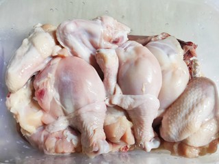 Raw Chicken Pieces in Plastic Containers. Selective Focus.