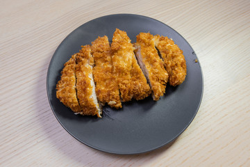 A plate of tonkatsu (pork cutlet).