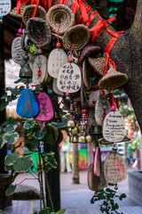 The decorated plaques with written wishes that, according to tradition, will come true in the tropical forest in Yanoda Park,  Sanya city. Hainan island, China.