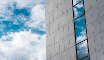 business center bulding windows with sky reflections