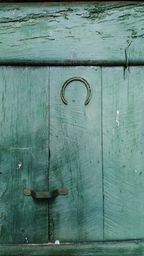 Horseshoe On Wooden Door