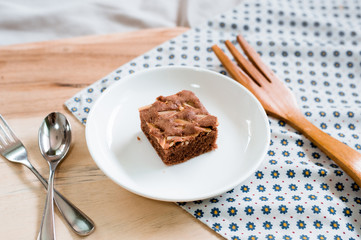 Chocolate brownie squares on cutting board