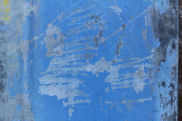 wall paint that has been damaged and peeling and dirty