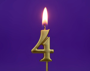 Burning golden birthday candles on blue background, number 4
