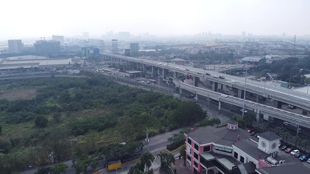 Manila with pollution in the horizon, skyway and skyline.