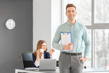 Male secretary and his beautiful boss in office