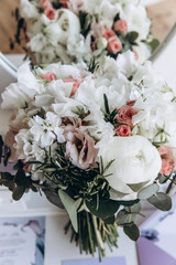 Beautiful wedding bouquet. Delicate rose petals. The morning of the bride.