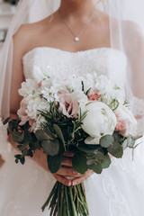 Beautiful wedding bouquet. Delicate rose petals. The morning of the bride.