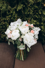 Beautiful wedding bouquet. Delicate rose petals. The morning of the bride.