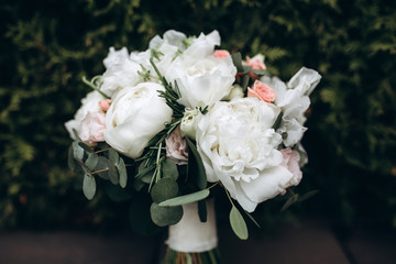 Beautiful wedding bouquet. Delicate rose petals. The morning of the bride.