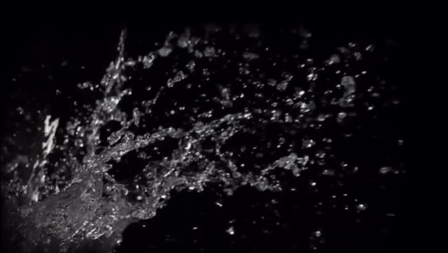 Slow Motion shot of water splash on black Background.