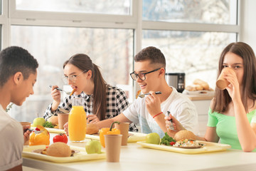 Pupils having lunch at school canteen
