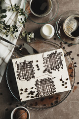 Composition with tiramisu on brown background, top view. Sweet dessert