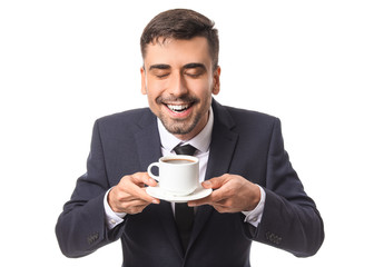 Young businessman with cup of hot coffee on white background
