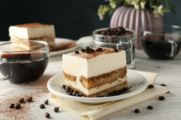 Composition with tasty tiramisu on white wooden background. Delicious dessert