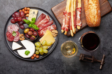 Cheese, meat, grapes and olives antipasto
