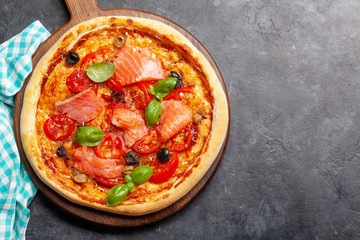 Tasty homemade seafood pizza with salmon