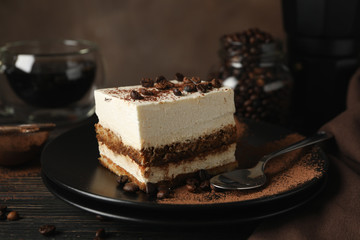 Composition with tasty tiramisu and coffee on wooden background