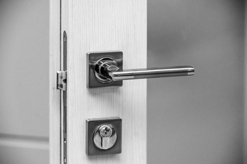Metal door handle on a white background
