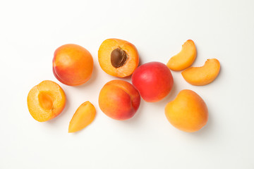 Tasty apricots on white background, top view