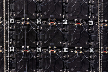 Abstract electronical background with multiple displays stitched together. Back view.