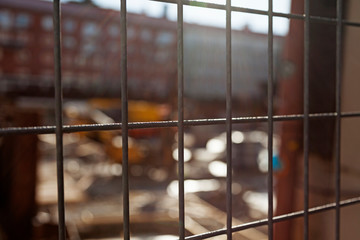 behind the fence to a construction site in Umea