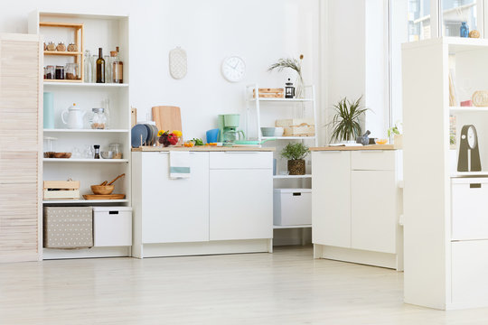 Image of domestic white kitchen with kitchen utensils and food