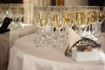 Table with glass champagne glasses