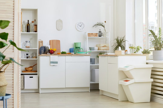 Image of modern kitchen with white furniture at house