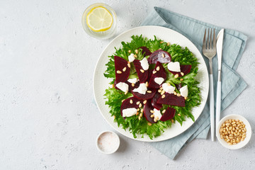 salad with beet, curd, feta, ricotta and pine nuts, lettuce. Healthy keto ketogenic dash diet