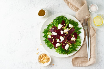 salad with beet, curd, feta, ricotta and pine nuts, lettuce. Healthy keto ketogenic dash diet