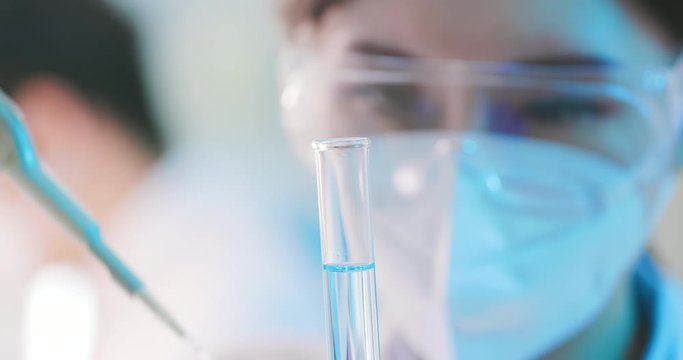 scientist take test tube