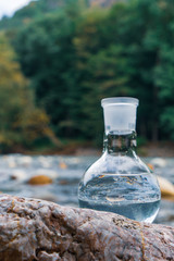 Glass flask with clean drinking water.