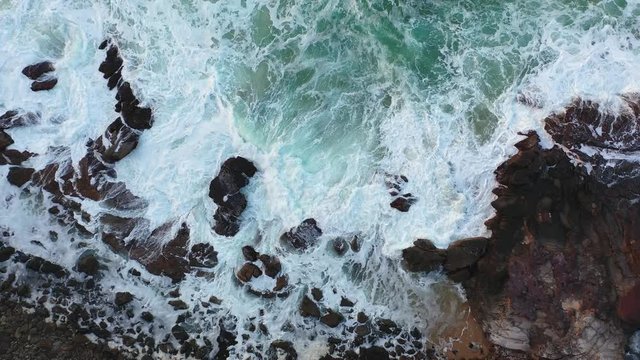 Waves crashing on rocks. Sunshine Coast, Coolum, Queensland, Australia.
