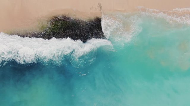 Dreamland Beach Bali from above, aerial 4k footage. Azure water and punch colors, white sand beach.