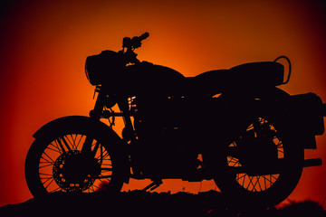 Fototapeta na wymiar silhouette of a motorcycle, traveling