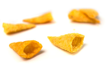 Closeup of salted appetizers pile on white background