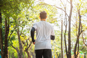 Obraz premium Handsome Healthy runner jogging outdoor. Fitness and sport healthy lifestyle concept.